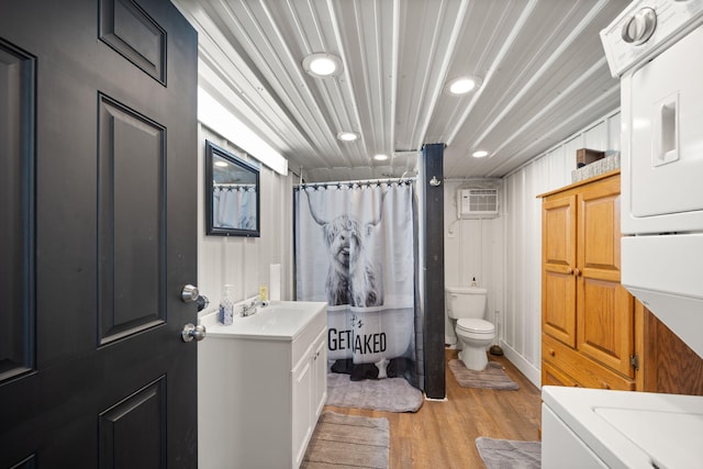 61 Cumberland Cv, Nancy, KY 42544 - bathroom with stacked washer / drying machine, toilet, wood finished floors, vanity, and recessed lighting