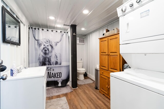 61 Cumberland Cv, Nancy, KY 42544 - full bathroom with stacked washing machine and dryer, vanity, toilet, wood finished floors, and recessed lighting