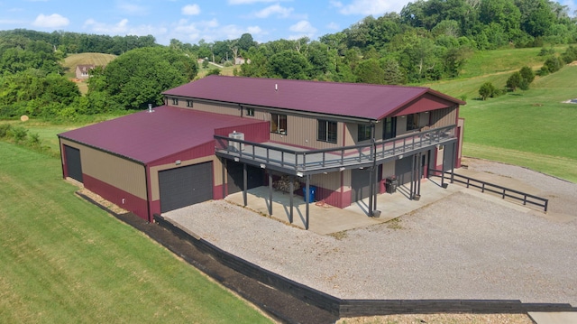 61 Cumberland Cv, Nancy, KY 42544 - rear view of house featuring a yard, a deck, a garage, and gravel driveway