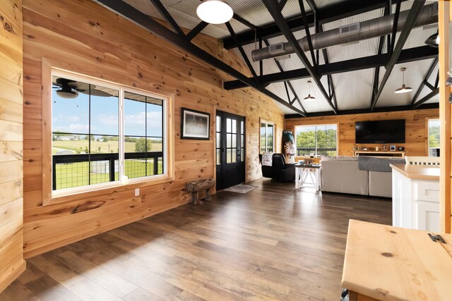 61 Cumberland Cv, Nancy, KY 42544 - living area featuring wooden walls, hardwood / wood-style floors, beam ceiling, high vaulted ceiling, and french doors
