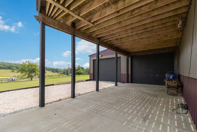 61 Cumberland Cv, Nancy, KY 42544 - view of patio / terrace featuring view of golf course, an outbuilding, and a detached garage