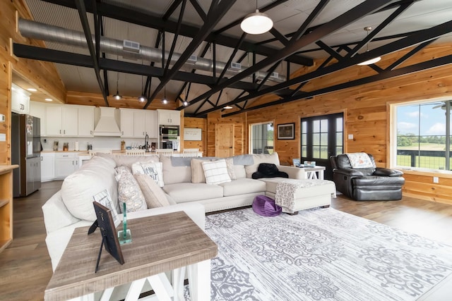 61 Cumberland Cv, Nancy, KY 42544 - living room featuring wood finished floors, wooden walls, and high vaulted ceiling