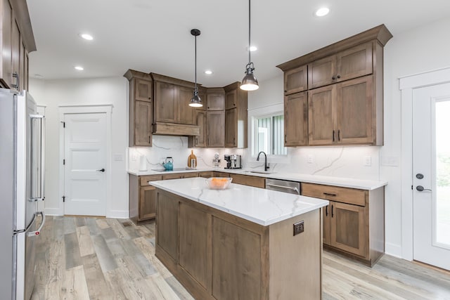 269 Ashley Camp Rd, Harrodsburg, KY 40330 - kitchen with light wood-style flooring, a sink, stainless steel appliances, a center island, and hanging light fixtures