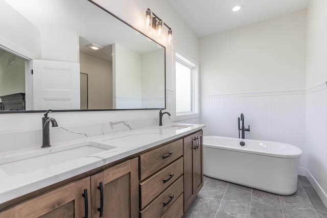269 Ashley Camp Rd, Harrodsburg, KY 40330 - full bath with a wainscoted wall, a freestanding tub, and double vanity