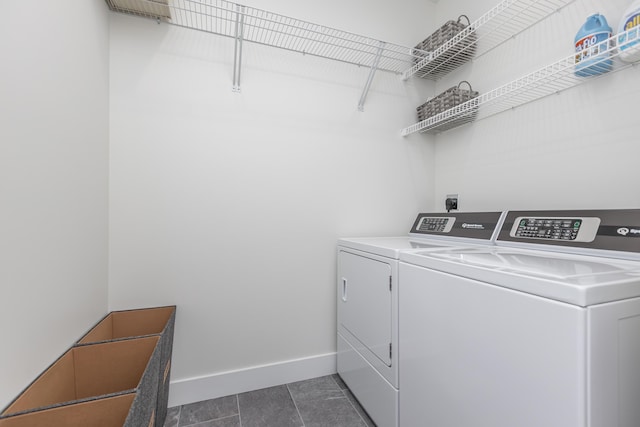 269 Ashley Camp Rd, Harrodsburg, KY 40330 - washroom with washer and dryer, baseboards, and dark tile patterned flooring