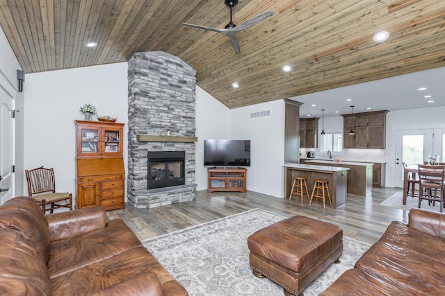 269 Ashley Camp Rd, Harrodsburg, KY 40330 - living area with ceiling fan, a fireplace, wooden ceiling, light wood finished floors, and recessed lighting