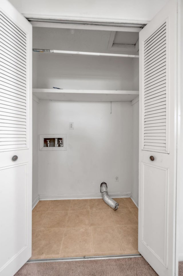 laundry room featuring washer hookup, light tile patterned floors, attic access, and baseboards