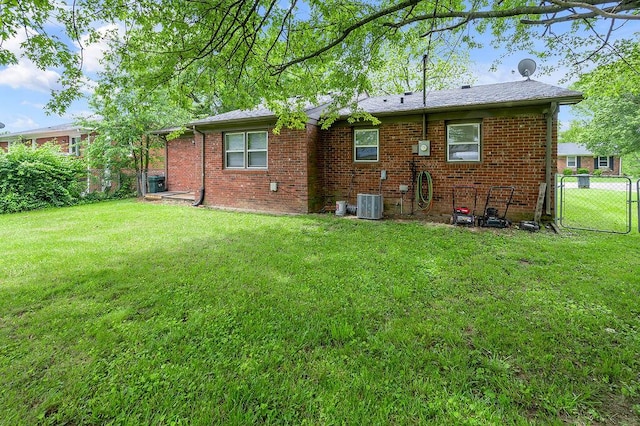 rear view of house with brick siding