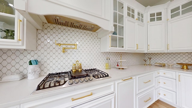 840 A T Dean Rd, Harrodsburg, KY 40330 - kitchen with light countertops, decorative backsplash, white cabinetry, and stainless steel gas stovetop