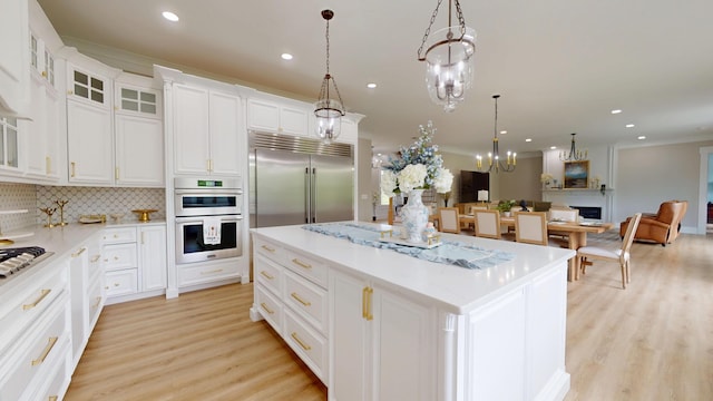 840 A T Dean Rd, Harrodsburg, KY 40330 - kitchen featuring stainless steel appliances, light wood-style floors, a center island, recessed lighting, and white cabinetry