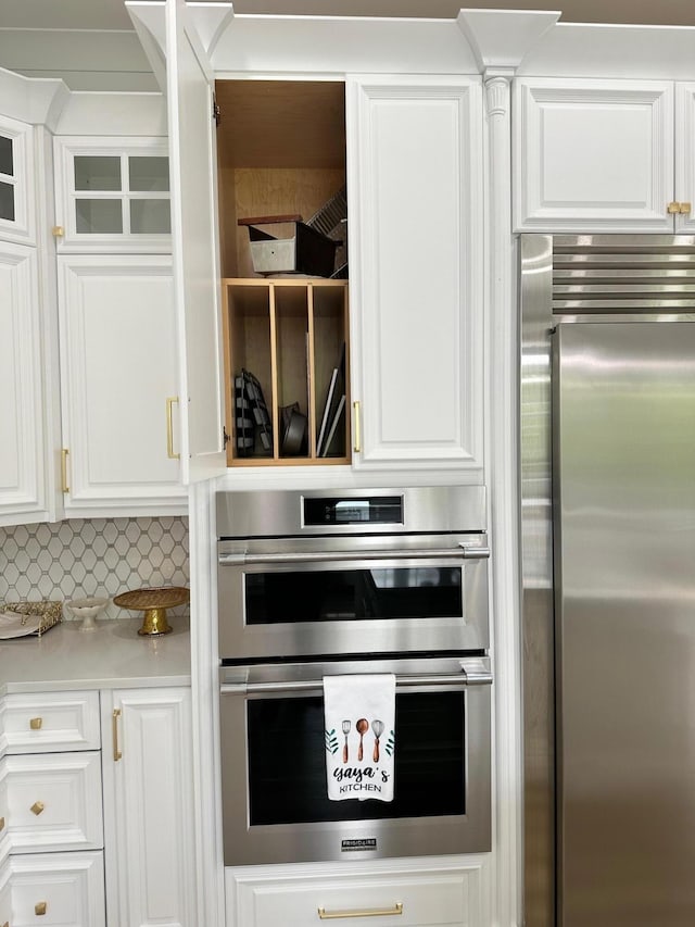 840 A T Dean Rd, Harrodsburg, KY 40330 - kitchen featuring appliances with stainless steel finishes, white cabinetry, light countertops, and decorative backsplash