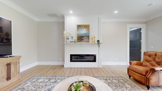 840 A T Dean Rd, Harrodsburg, KY 40330 - living area featuring wood finished floors, crown molding, a glass covered fireplace, baseboards, and recessed lighting