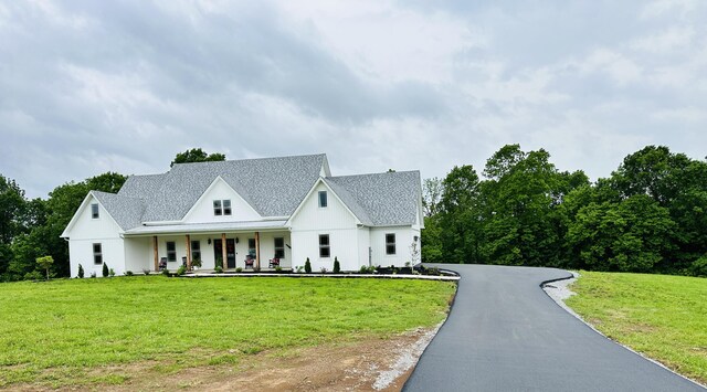 840 A T Dean Rd, Harrodsburg, KY 40330 - modern farmhouse style home featuring covered porch, a front lawn, a shingled roof, and driveway