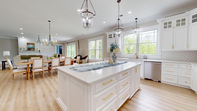 840 A T Dean Rd, Harrodsburg, KY 40330 - kitchen featuring dishwasher, a chandelier, light wood-style flooring, a kitchen island, and backsplash