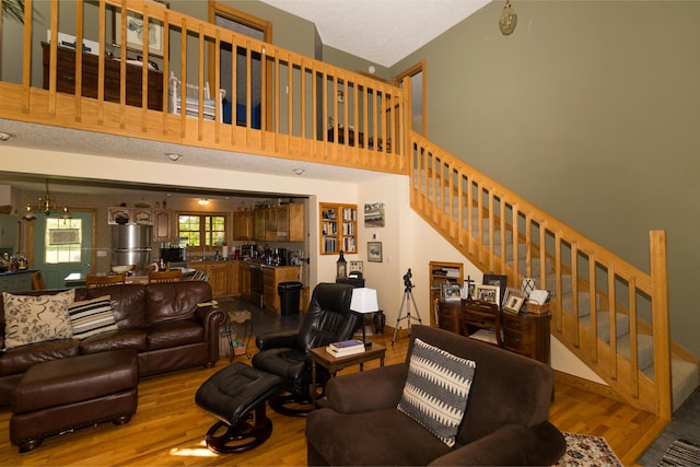 388 Mc Roberts Rd, Wallingford, KY 41093 - living room with wood finished floors, stairs, bar, and a high ceiling