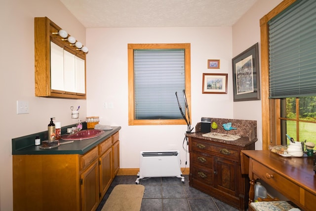 388 Mc Roberts Rd, Wallingford, KY 41093 - bathroom with two vanities, tile patterned floors, and baseboards