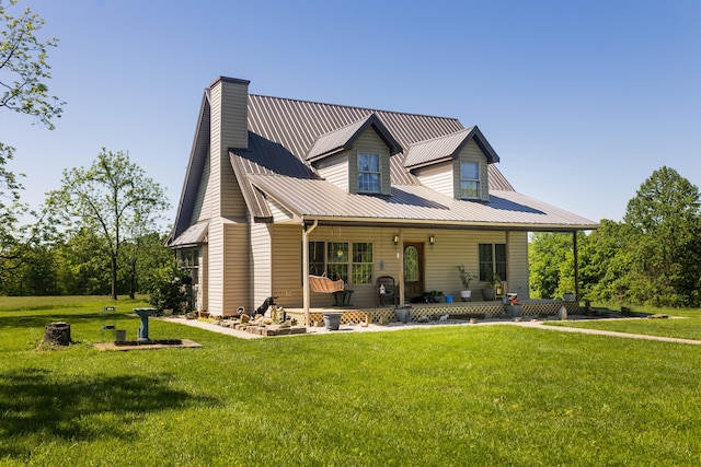 388 Mc Roberts Rd, Wallingford, KY 41093 - view of front of property with a chimney, a porch, a front lawn, and metal roof