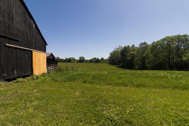 388 Mc Roberts Rd, Wallingford, KY 41093 - view of green lawn with a barn, an outbuilding, a view of countryside, and a detached garage