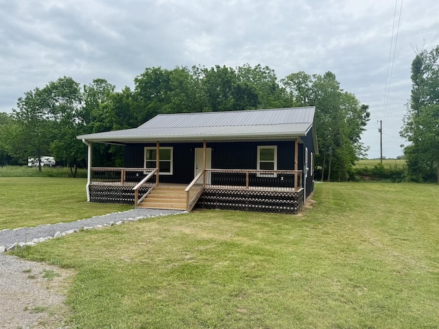 439 Logan Antle Rd, Jamestown, KY 42629 - view of front of home with covered porch, board and batten siding, a front yard, and metal roof