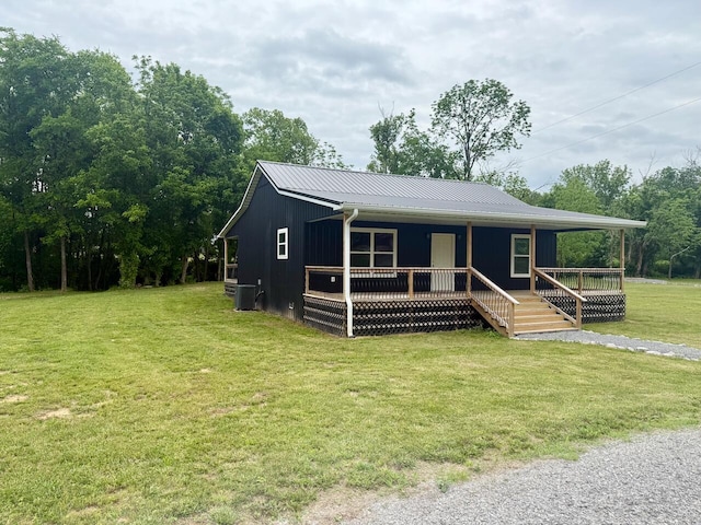 439 Logan Antle Rd, Jamestown, KY 42629 - view of front of property with central AC unit, a front lawn, a porch, and metal roof