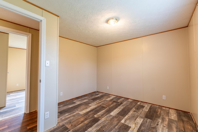 662 Clifty Hill Rd, Science Hill, KY 42553 - spare room with wood finished floors, a textured ceiling, and crown molding