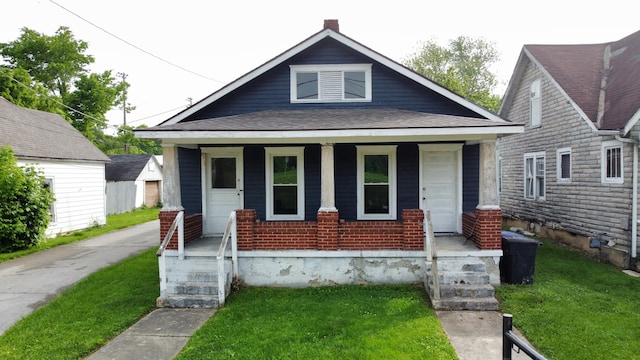 712-726 Benson Ave, Frankfort, KY 40601 - bungalow featuring covered porch, a front yard, and roof with shingles