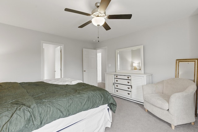 bedroom with light carpet and ceiling fan