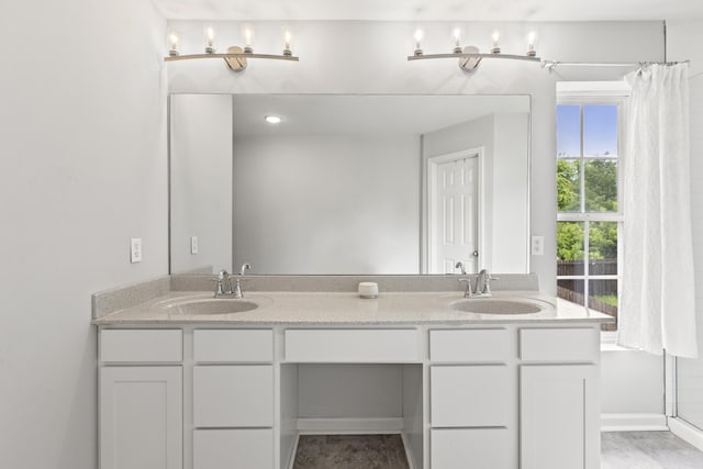 full bathroom with double vanity and curtained shower