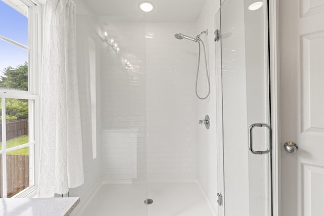 full bath featuring a shower stall