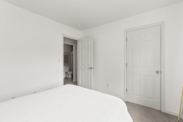 bedroom with light carpet and baseboards