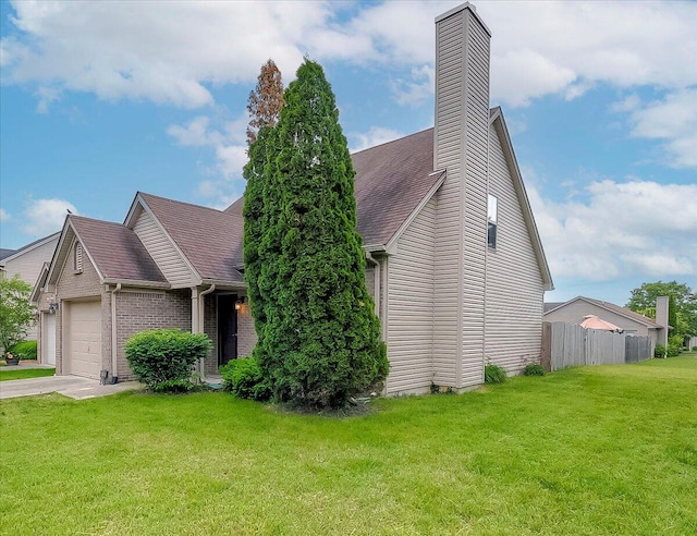 view of front facade featuring an attached garage, a chimney, roof with shingles, brick siding, and driveway