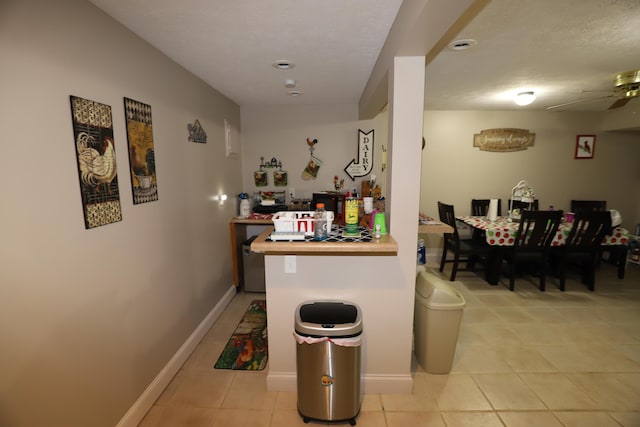 71 View Point Dr, Somerset, KY 42503 - kitchen with light tile patterned floors, a ceiling fan, and baseboards