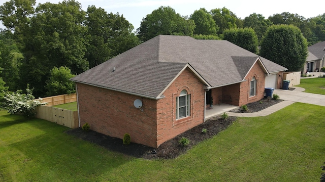 71 View Point Dr, Somerset, KY 42503 - view of side of home featuring roof with shingles, brick siding, and concrete driveway