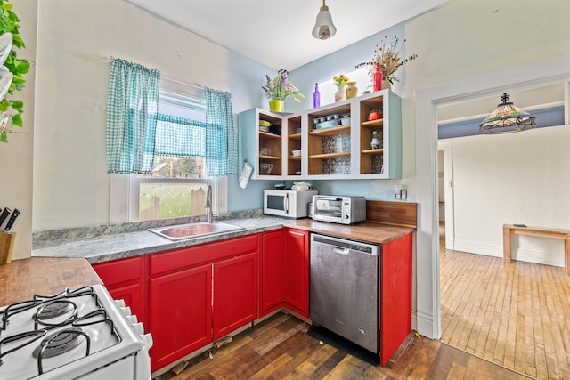 kitchen with white appliances, a sink, open shelves, dark wood-style flooring, and light countertops