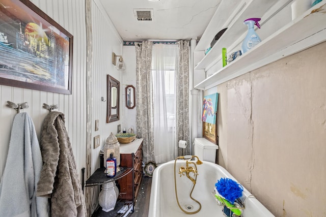 full bathroom with a soaking tub