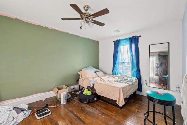 bedroom with hardwood / wood-style flooring and ceiling fan
