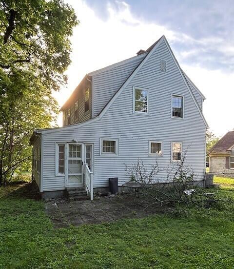 back of house with entry steps