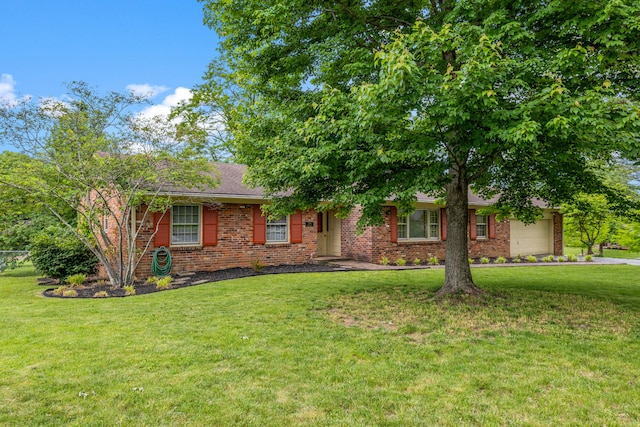 3540 Cornwall Dr, Lexington, KY 40503 - view of front of home featuring brick siding, a front yard, and an attached garage