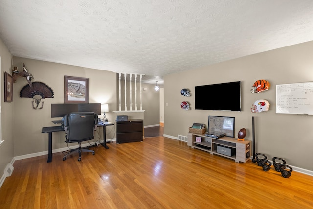3540 Cornwall Dr, Lexington, KY 40503 - home office with a textured ceiling, wood finished floors, and baseboards