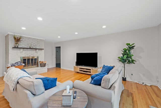 3540 Cornwall Dr, Lexington, KY 40503 - living room featuring light wood-style floors, a brick fireplace, recessed lighting, and baseboards
