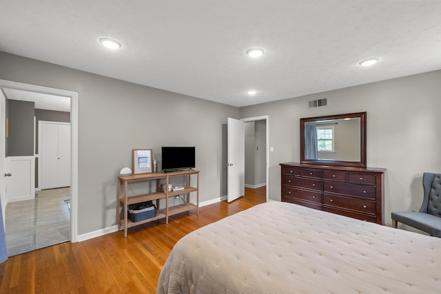 3540 Cornwall Dr, Lexington, KY 40503 - bedroom featuring baseboards, wood finished floors, and recessed lighting
