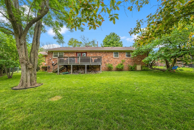 3540 Cornwall Dr, Lexington, KY 40503 - rear view of house featuring a deck, brick siding, stairs, and a yard