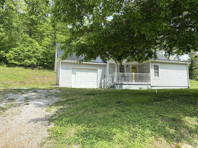 842 Lower Cane Creek Rd, Stanton, KY 40380 - obstructed view of property with driveway, a porch, metal roof, and a front lawn