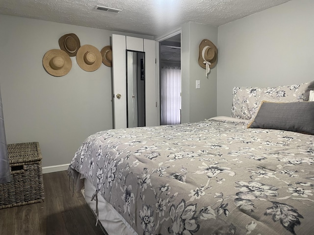 842 Lower Cane Creek Rd, Stanton, KY 40380 - bedroom with wood finished floors, a textured ceiling, and baseboards