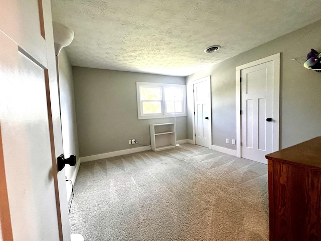 201 Longview St, Harrodsburg, KY 40330 - unfurnished bedroom with light carpet, baseboards, and a textured ceiling