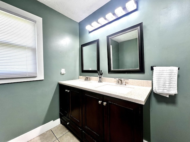 201 Longview St, Harrodsburg, KY 40330 - bathroom with tile patterned flooring, double vanity, baseboards, and a textured ceiling