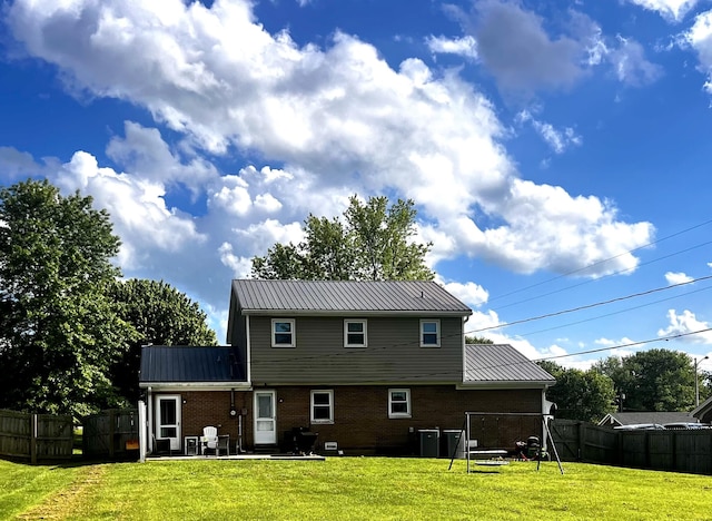 201 Longview St, Harrodsburg, KY 40330 - rear view of house with brick siding, a patio, and metal roof