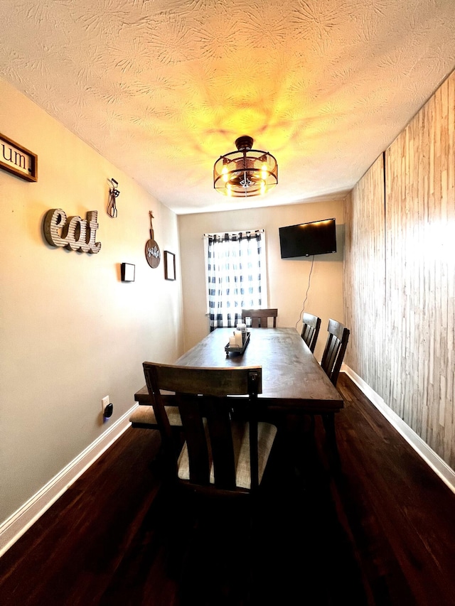 201 Longview St, Harrodsburg, KY 40330 - dining room with baseboards, wood finished floors, a textured ceiling, and wood walls