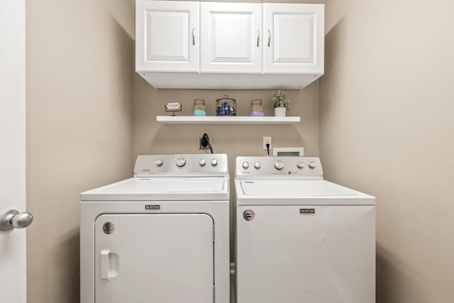 laundry area featuring cabinet space and independent washer and dryer