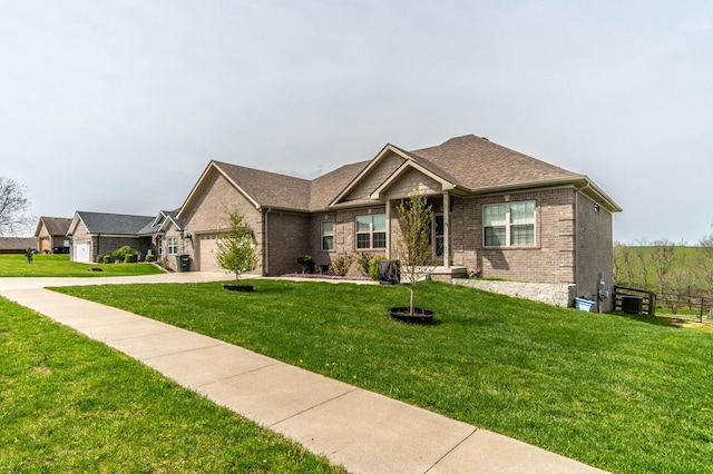 view of front of property featuring a front yard, brick siding, concrete driveway, and an attached garage